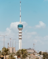 a tall white tower with a blue top