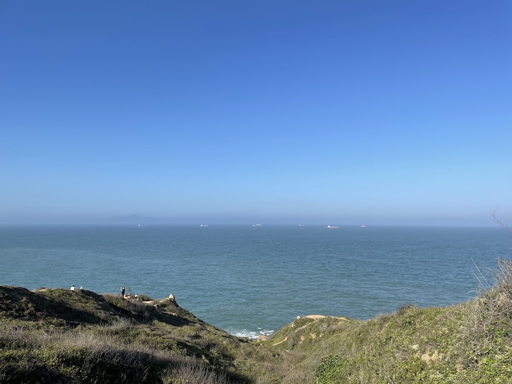 a view of a body of water from a hill