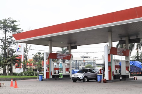 a car is parked at a gas station
