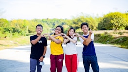 Our team of four dedicated trainers smiling together outside one of our training centers.