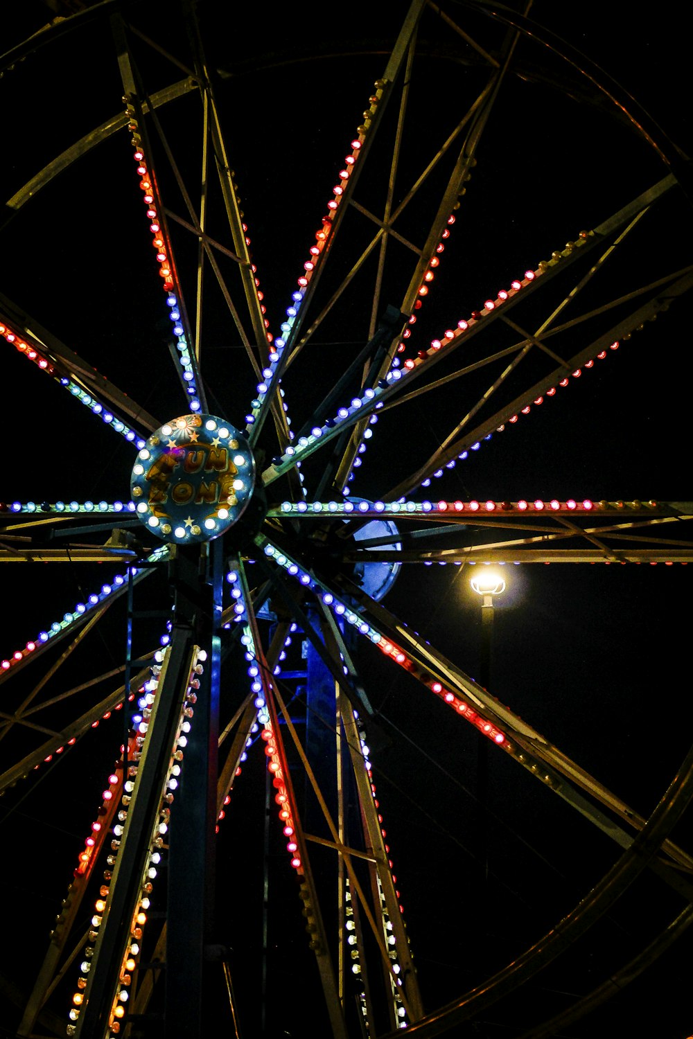 a ferris wheel is lit up at night