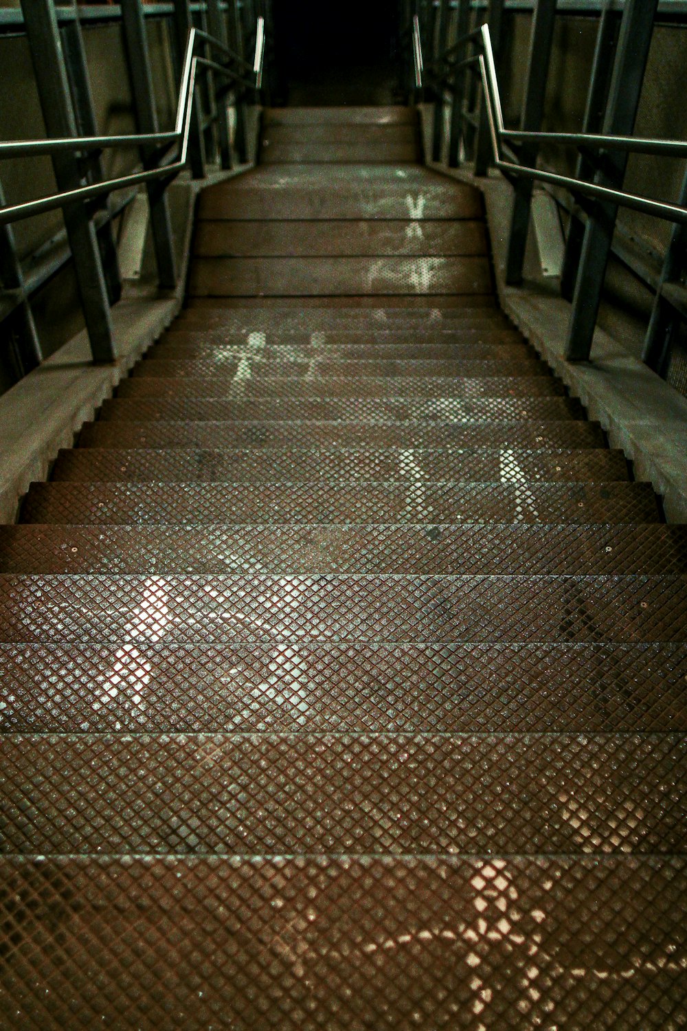 a set of stairs leading up to a tunnel