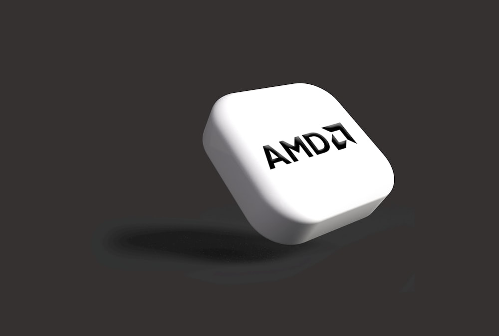 a white dice with the word amd on it