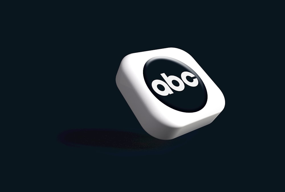 a white dice with the word abc on it