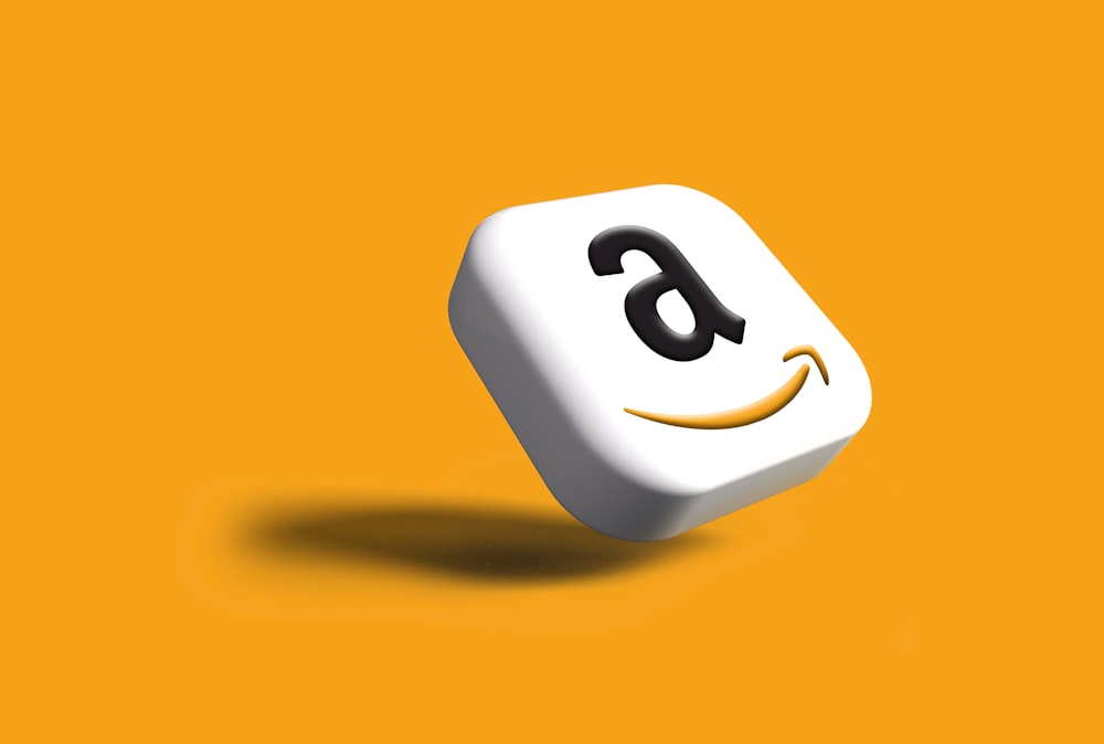 a close up of a dice with an amazon logo on it