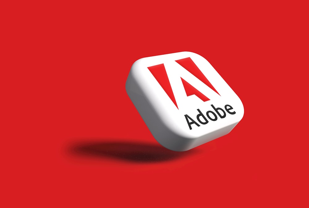the adobe logo on a red background