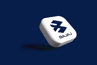 A floating, white, rounded square shape with a stylized 'B' logo and the word 'BAJAJ' on a dark blue background.
