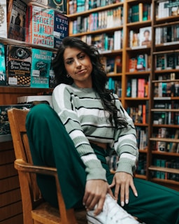 Portrait of Professor Sarah Oates in her university office surrounded by books on media and politics.
