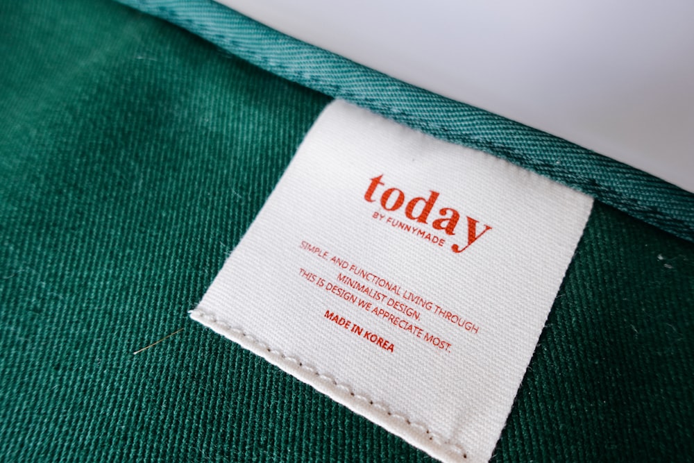 a label on a green shirt that says today