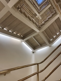 A clean and bright staircase in a traditional Bavarian building, freshly maintained.