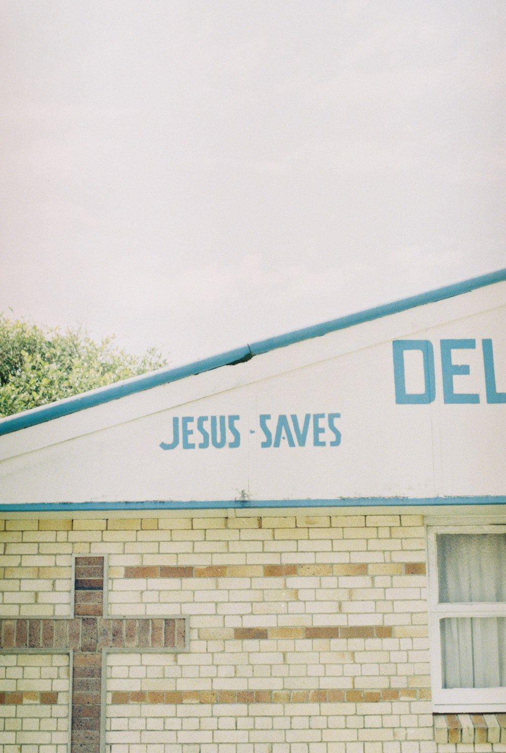 a building with a sign that says jesus saves