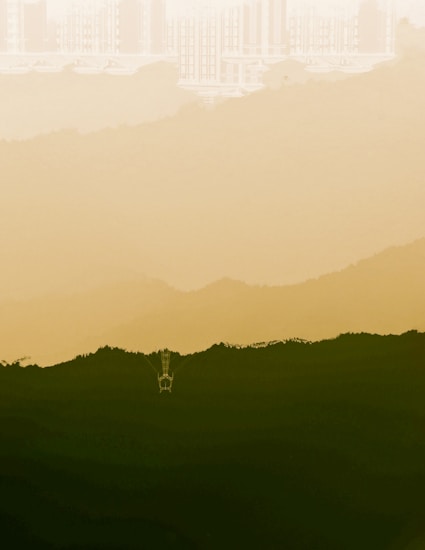 A minimalist landscape painting featuring misty mountains in shades of yellow and green, with a lone structure that resembles a tower or observation deck slightly visible in the foreground. The background presents faint outlines of urban buildings, creating a juxtaposition between nature and city elements.