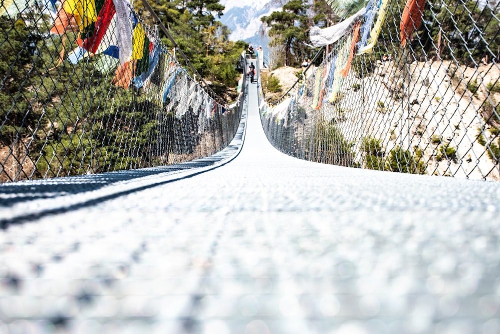 a view of a bridge that has many flags on it