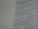 A close-up view of a book or document showing a section of text printed in a serif font. The text contains numbered lines, potentially verses or key points, and is formatted in a column layout. The background is a light color, typical of paper. The text on the left shows dotted lines, possibly for notes or annotations.