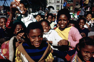 a group of young children standing next to each other