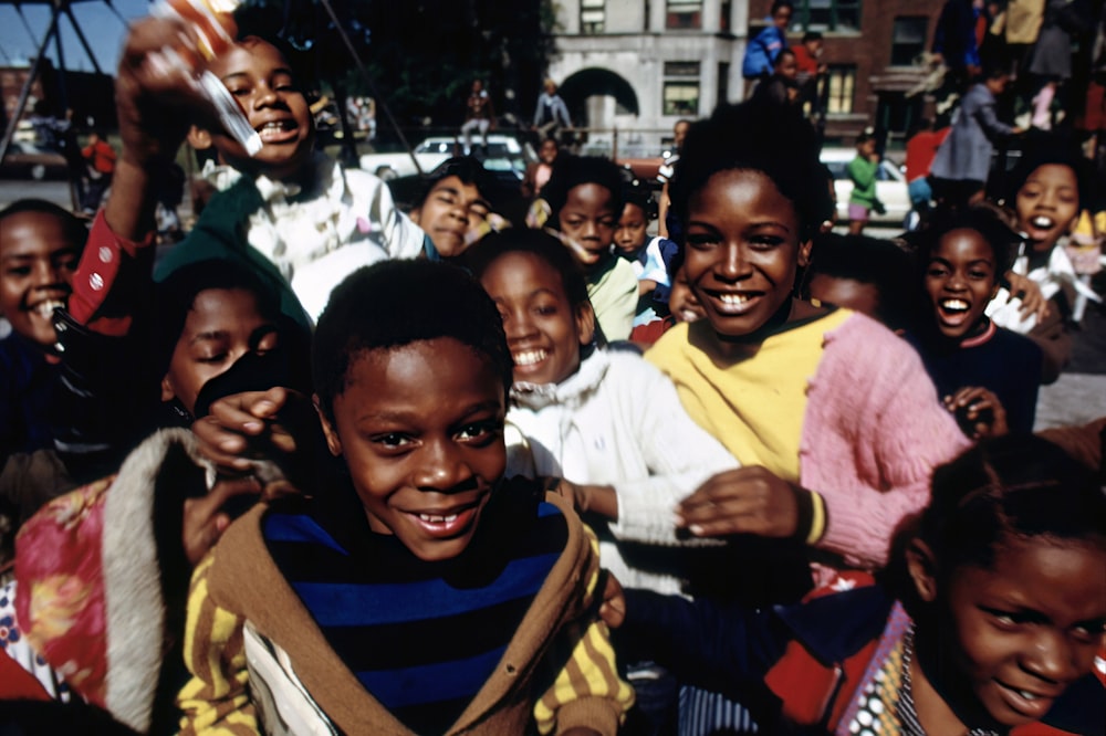 a group of young children standing next to each other