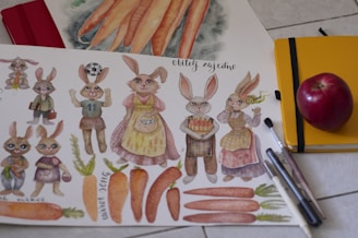 a drawing of carrots and rabbits on a table