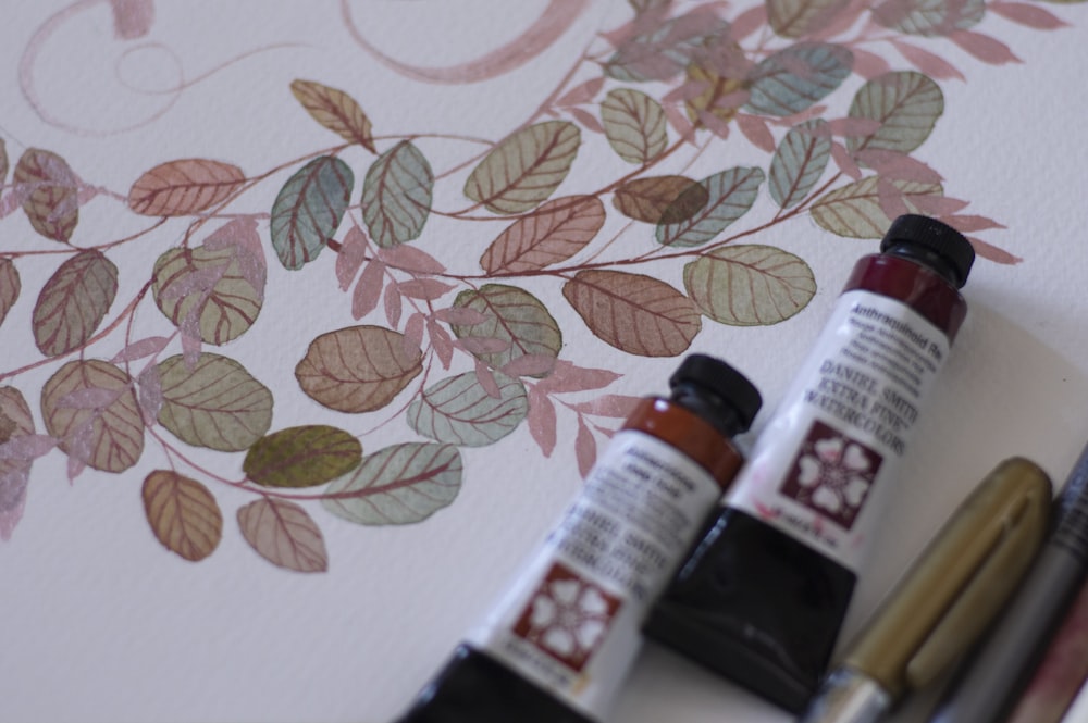 a couple of ink bottles sitting on top of a table