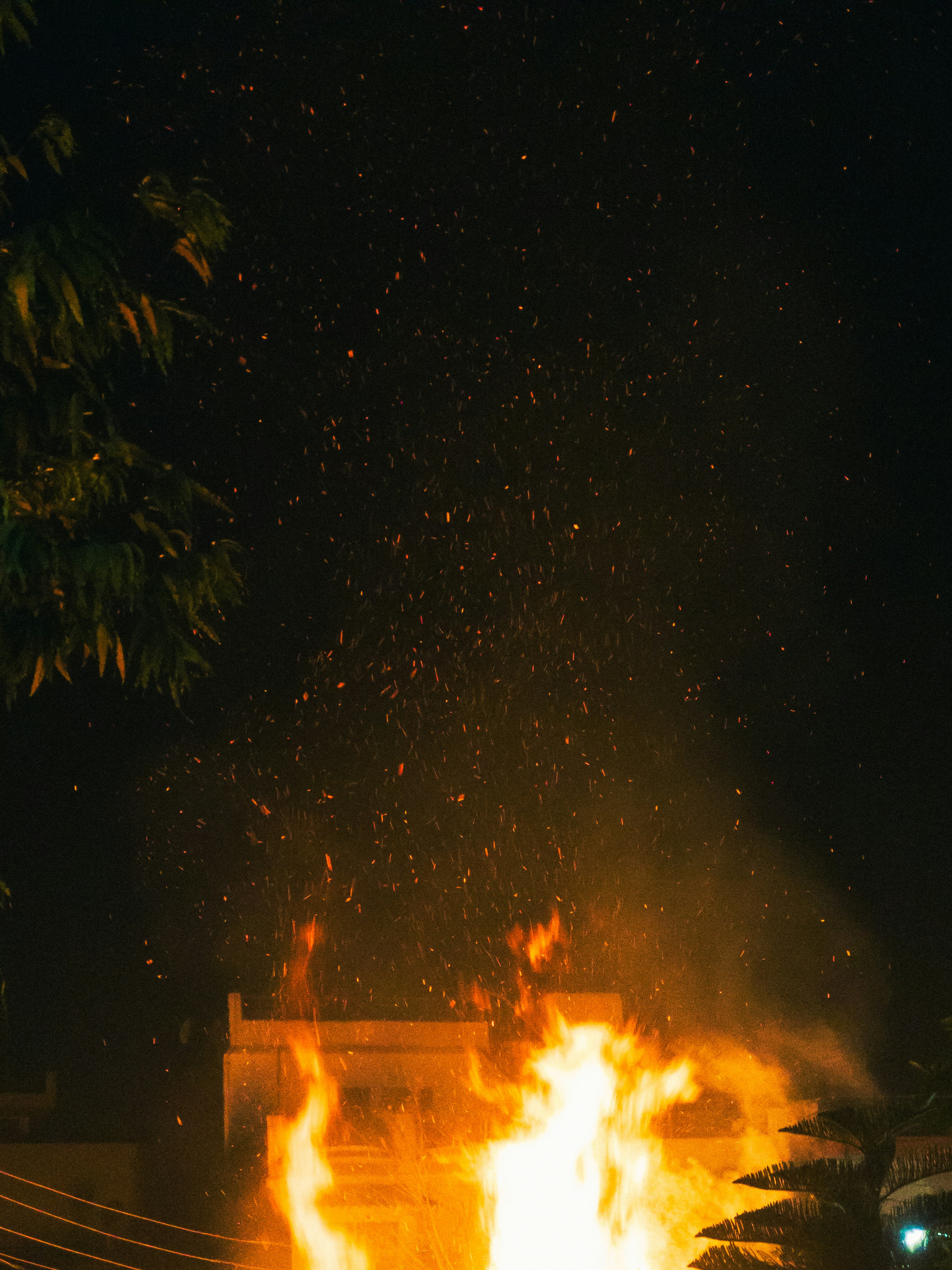Warm amber and red fire glow against dark sky