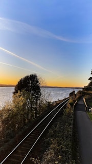 A scenic view of the Northeast Corridor tracks cutting through Boston’s historic waterfront at sunset.