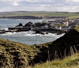 a view of a small town by the ocean