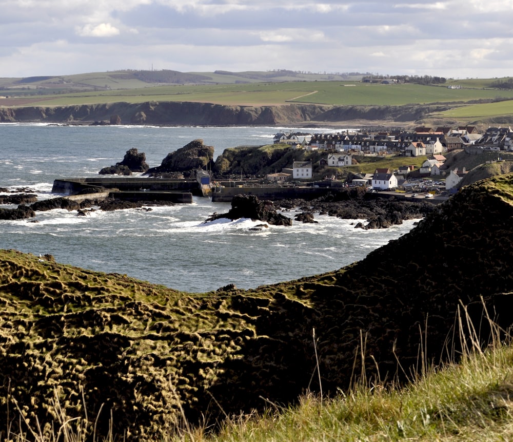 a view of a small town by the ocean