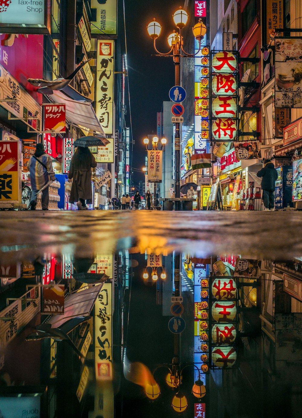 a city street filled with lots of tall buildings