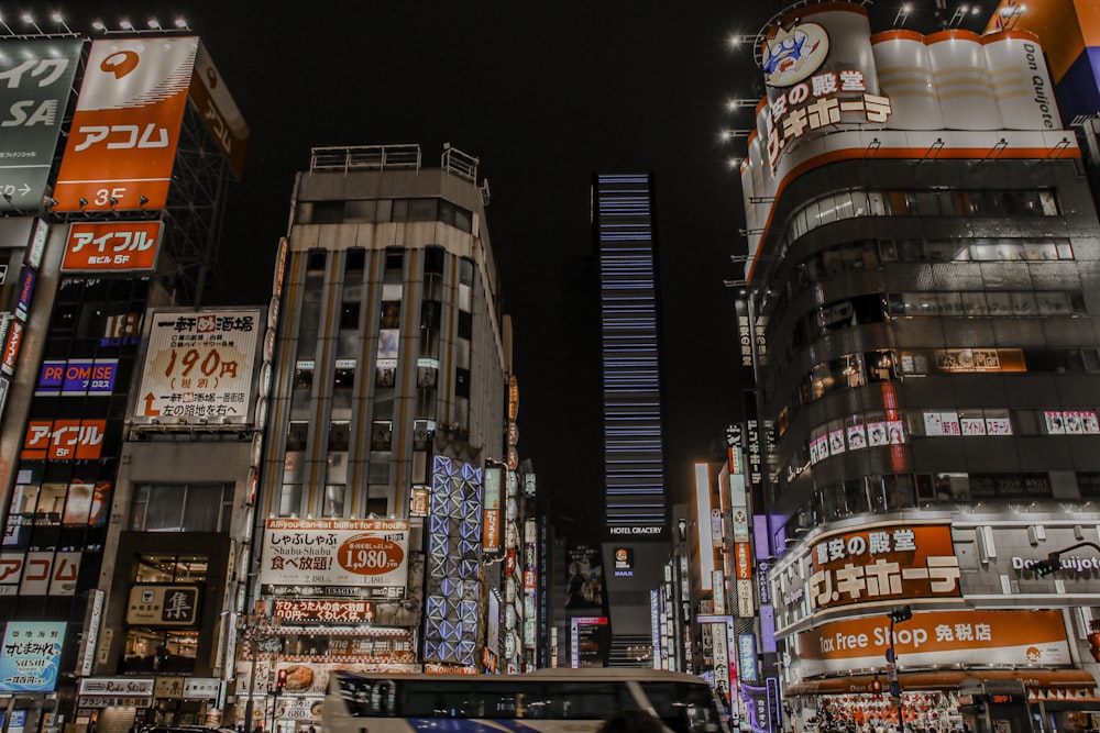 a city street filled with lots of tall buildings