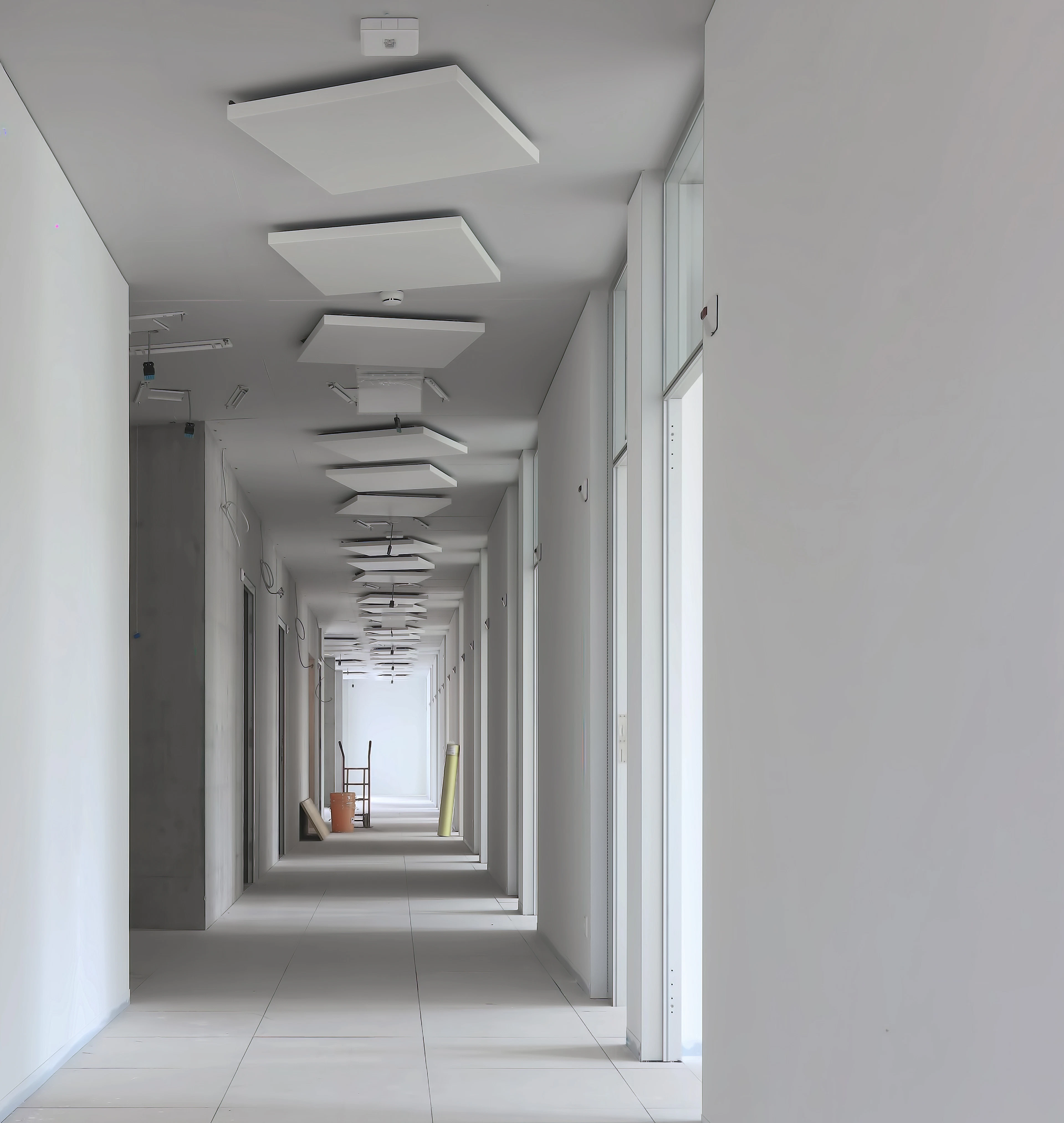 Long hallway with white walls
