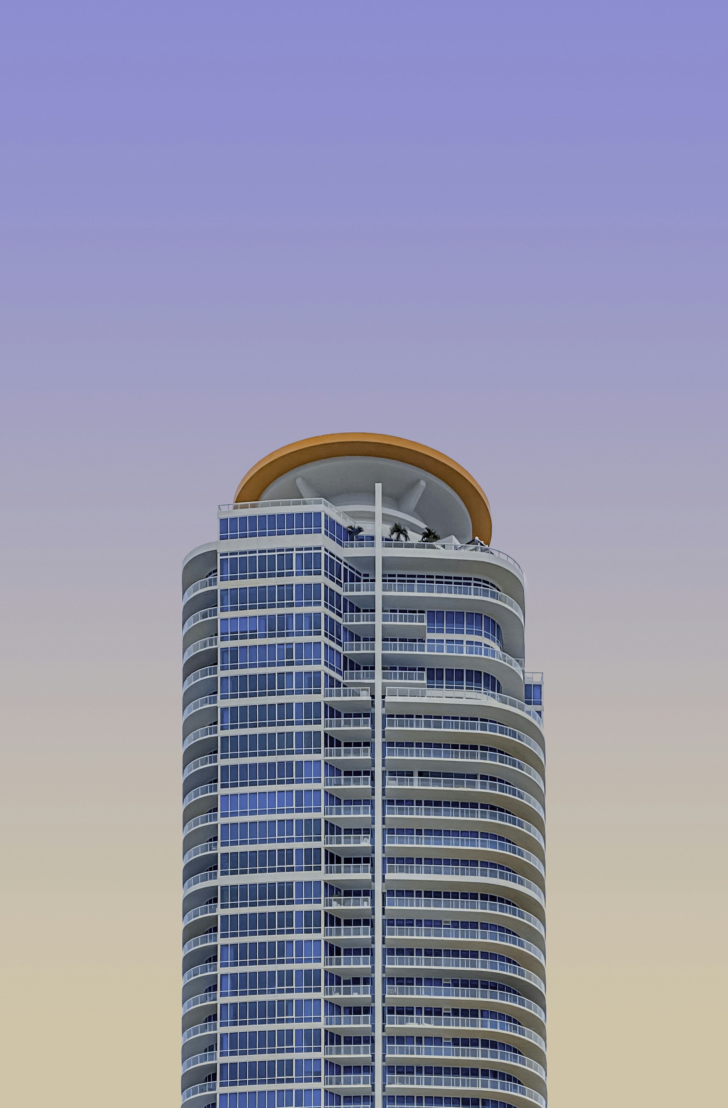 a very tall building with a sky background