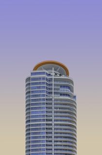 a very tall building with a sky background
