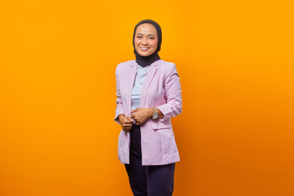 a woman in a purple jacket and a black scarf