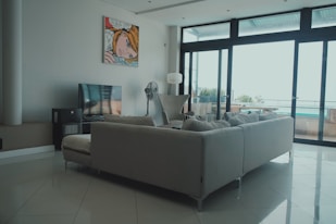 a living room filled with furniture and a flat screen tv