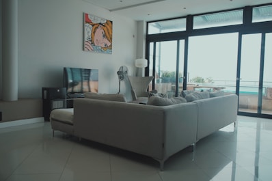 a living room filled with furniture and a flat screen tv