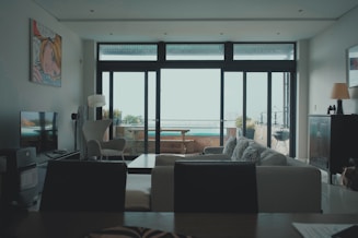 a living room filled with furniture and a flat screen tv