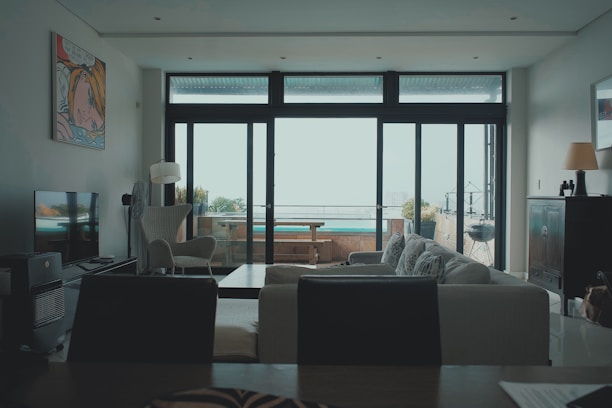 a living room filled with furniture and a flat screen tv