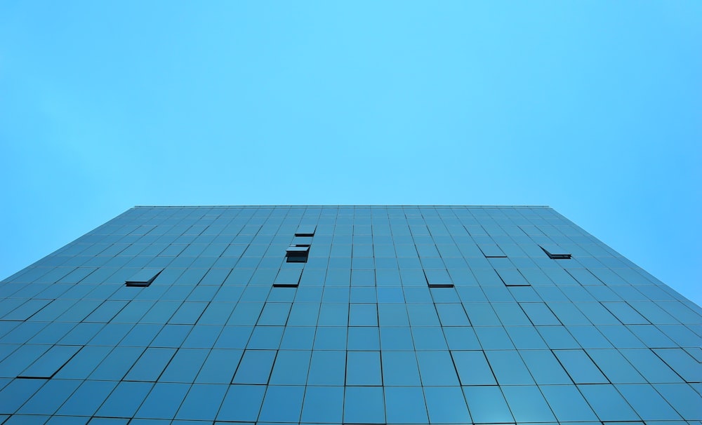 a very tall building with a sky in the background