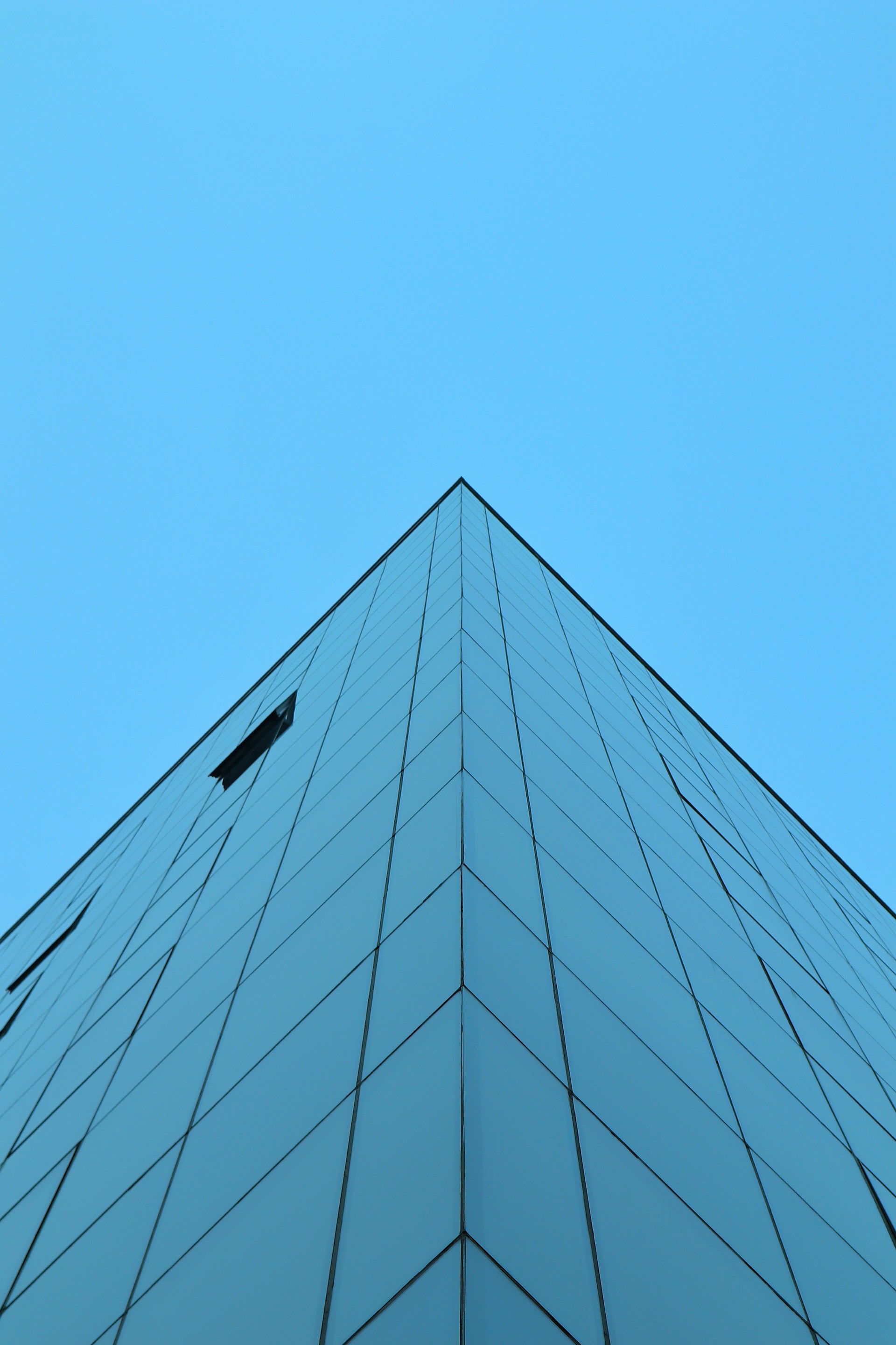 a very tall building with a sky in the background