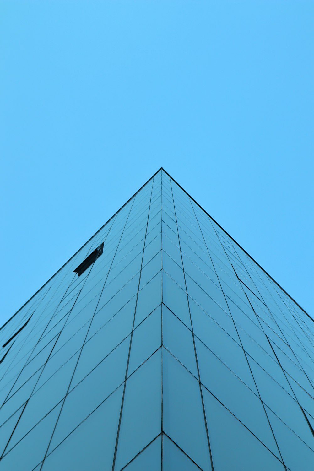 a very tall building with a sky in the background