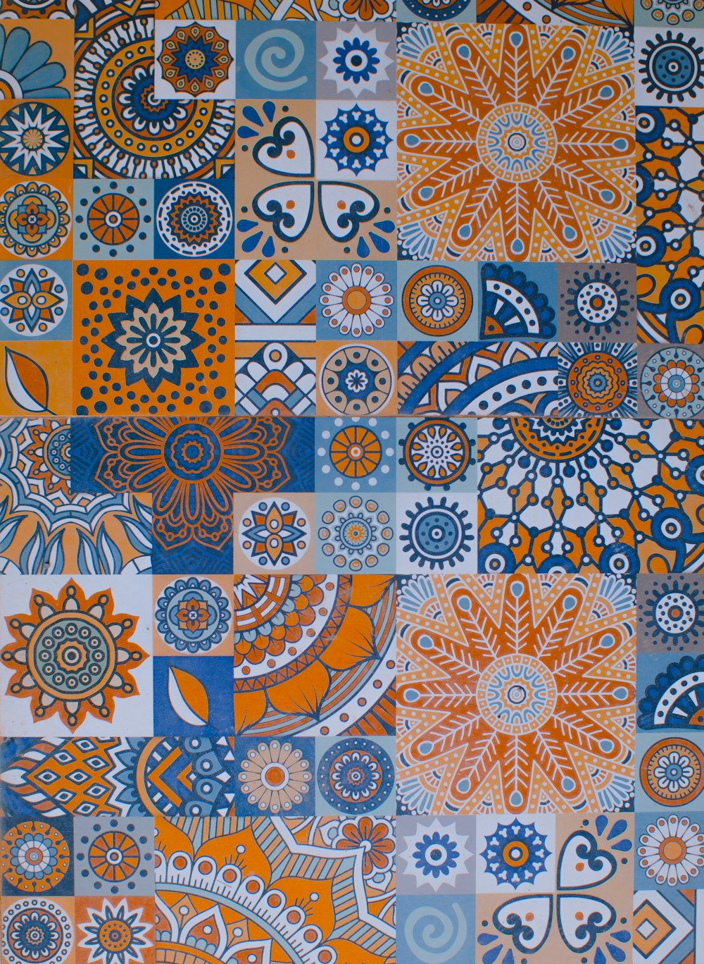 an orange, blue, and white patchwork design
