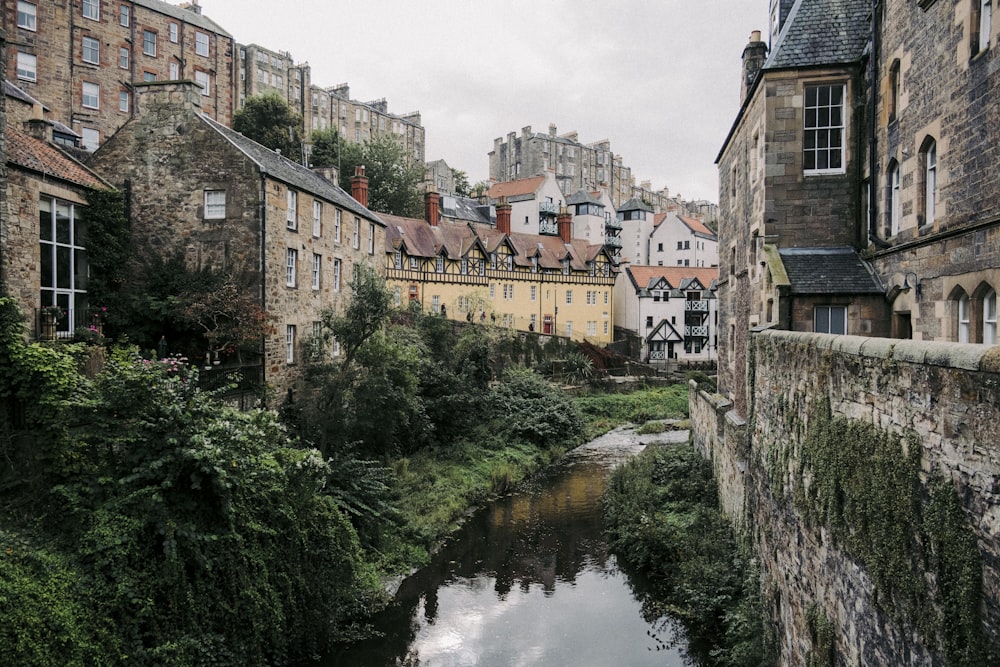 a river running through a city next to tall buildings