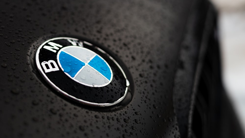 A close up of a bmw emblem on a black jacket photo – Free Einsiedeln Image  on Unsplash