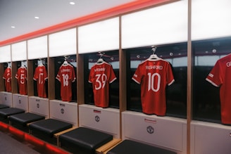 a row of lockers with jerseys on them