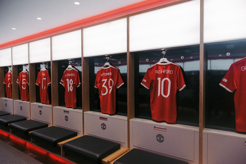 a row of lockers with jerseys on them