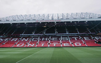 a soccer field with a banner on the side of it