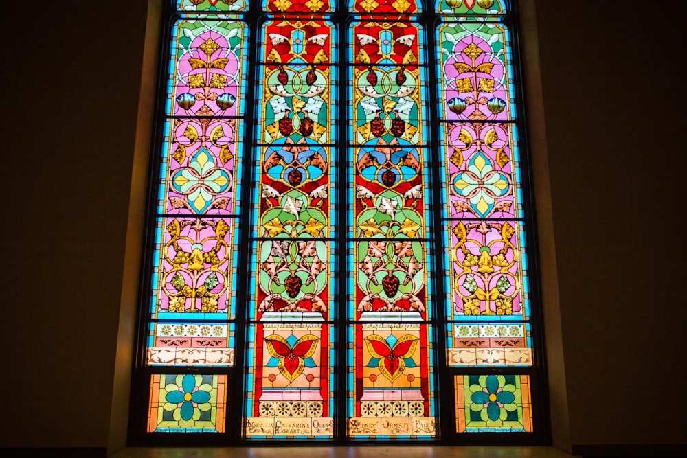 a colorful stained glass window in a church