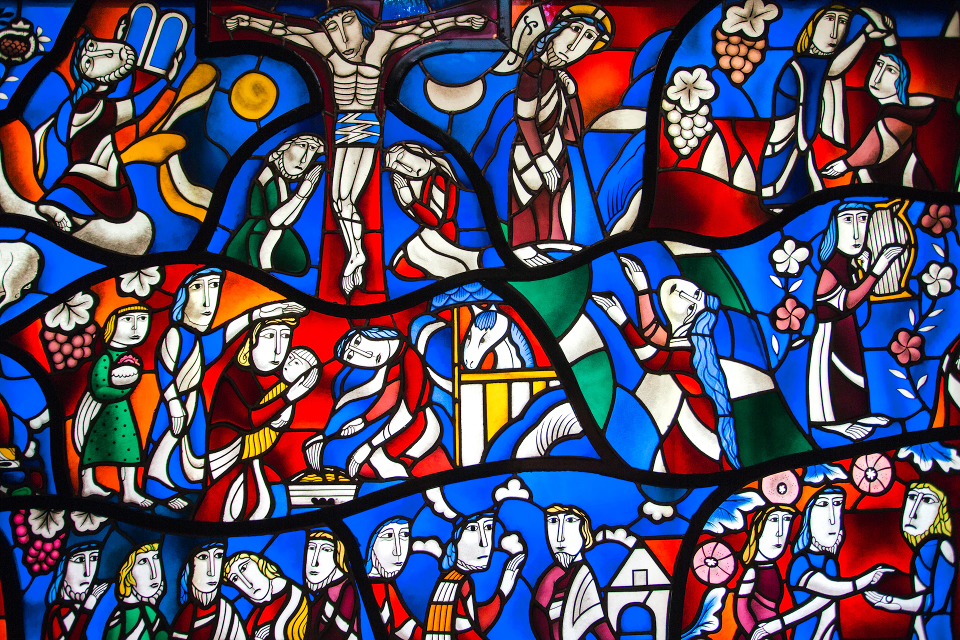 a stained glass window with a depiction of a crucifix