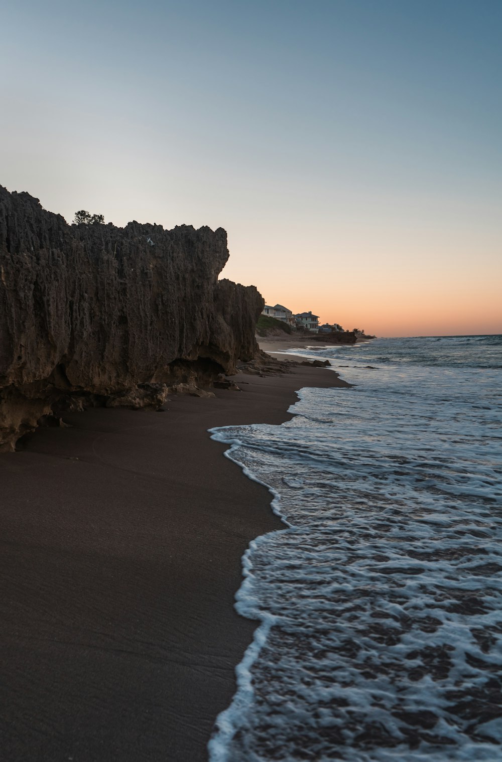 a beach with waves coming in to the shore