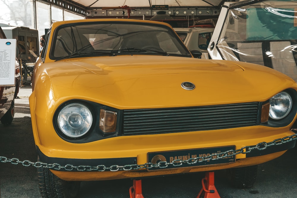 a yellow car is parked in a garage