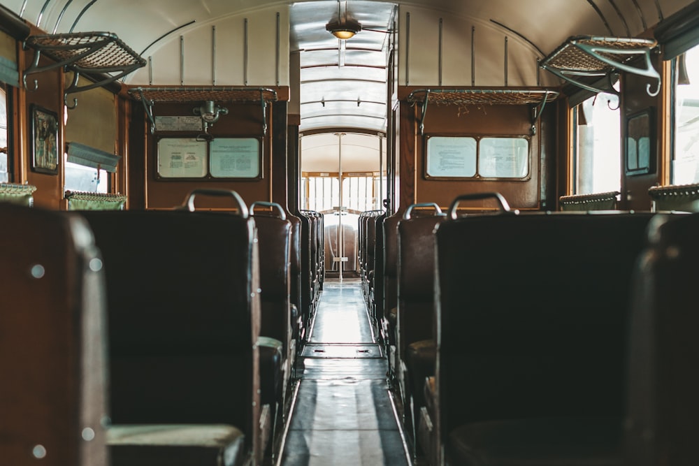 the inside of a train car with empty seats